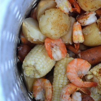 Shrimp Boil with Shrimp Potatoes Corn and Sausage made on the grill in a turkey fryer