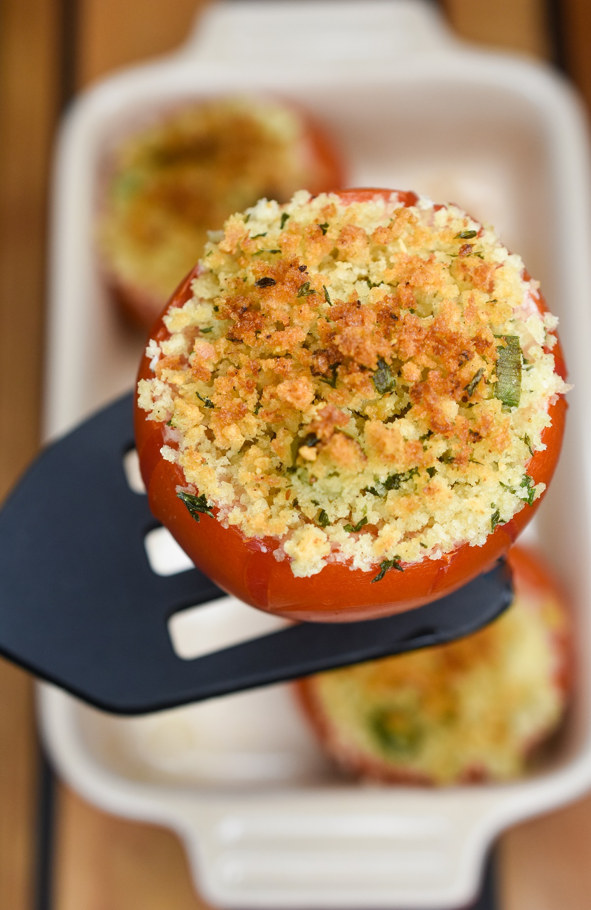 Stuffed Tomatoes Recipe Baked tomatoes stuffed with cheese topped with breadcrumbs. 