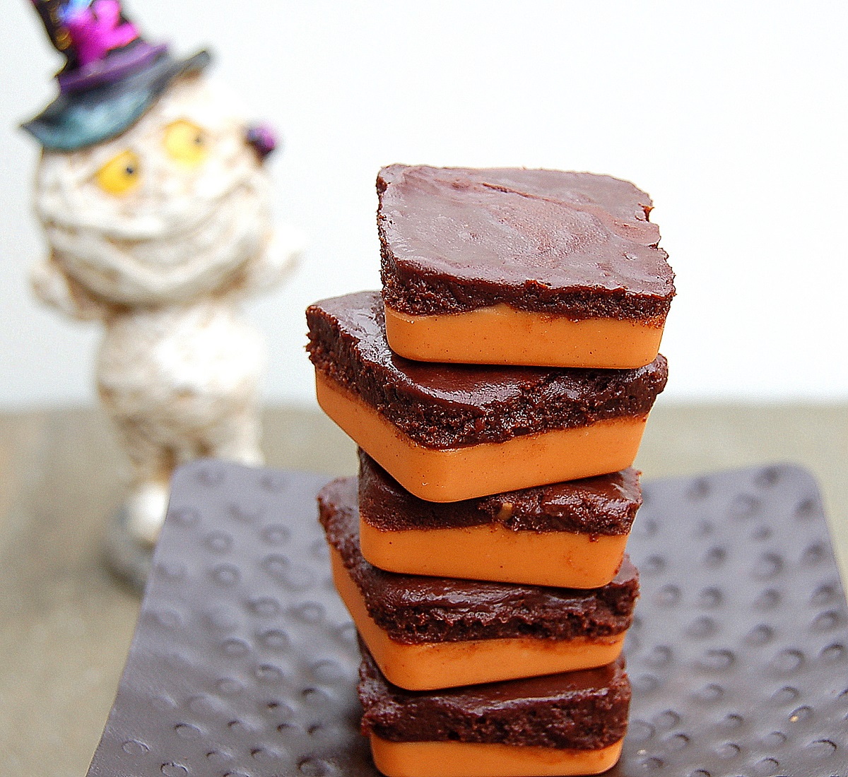 Halloween Chocolate and Peanut Butter Candy recipe stacked on top of one another.