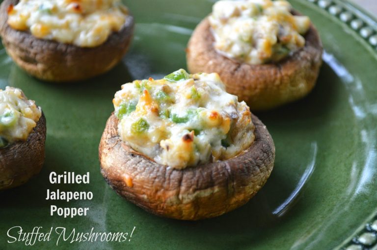 Grilled Mushrooms stuffed with Jalapeno Popper filling on a green plate