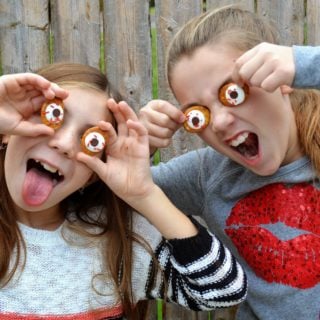edible eyeballs for halloween 2 young girls holding up homemade pretzel eyes making silly faces