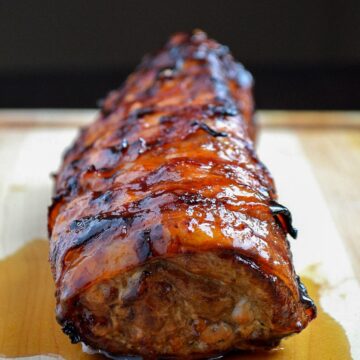 Grilled Bacon Wrapped Pork Tenderloin with a simple Honey Chipotle Sauce.