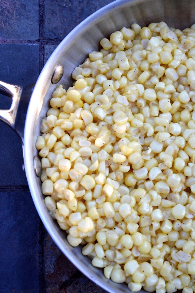 Fresh Corn cut off the cob, sauteed in butter and seasoned with salt