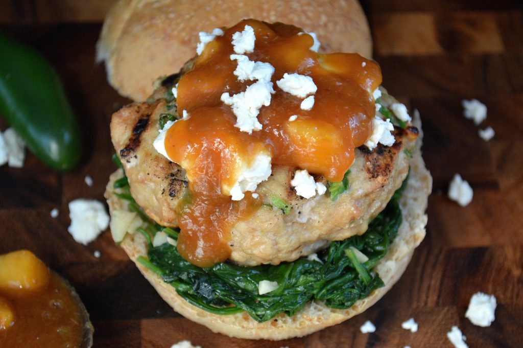 Jalapeno Chicken Burger with Bourbon Peach Jalapeno Sauce Goat Cheese and Sauteed Spinach