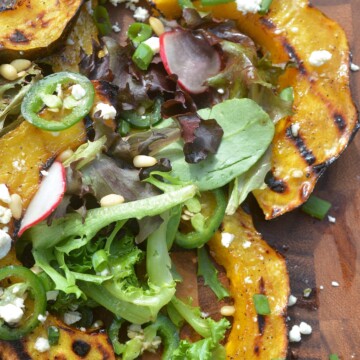 Grilled Acorn Squash Salad With Jalapenos, Fets Cheese and Pine Nuts and a Honey Lemon Vinaigrette