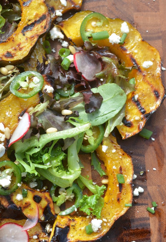 Grille Acorn Squash Salad With Jalapenos, Fets Cheese and Pine Nuts and a Honey Lemon Vinaigrette