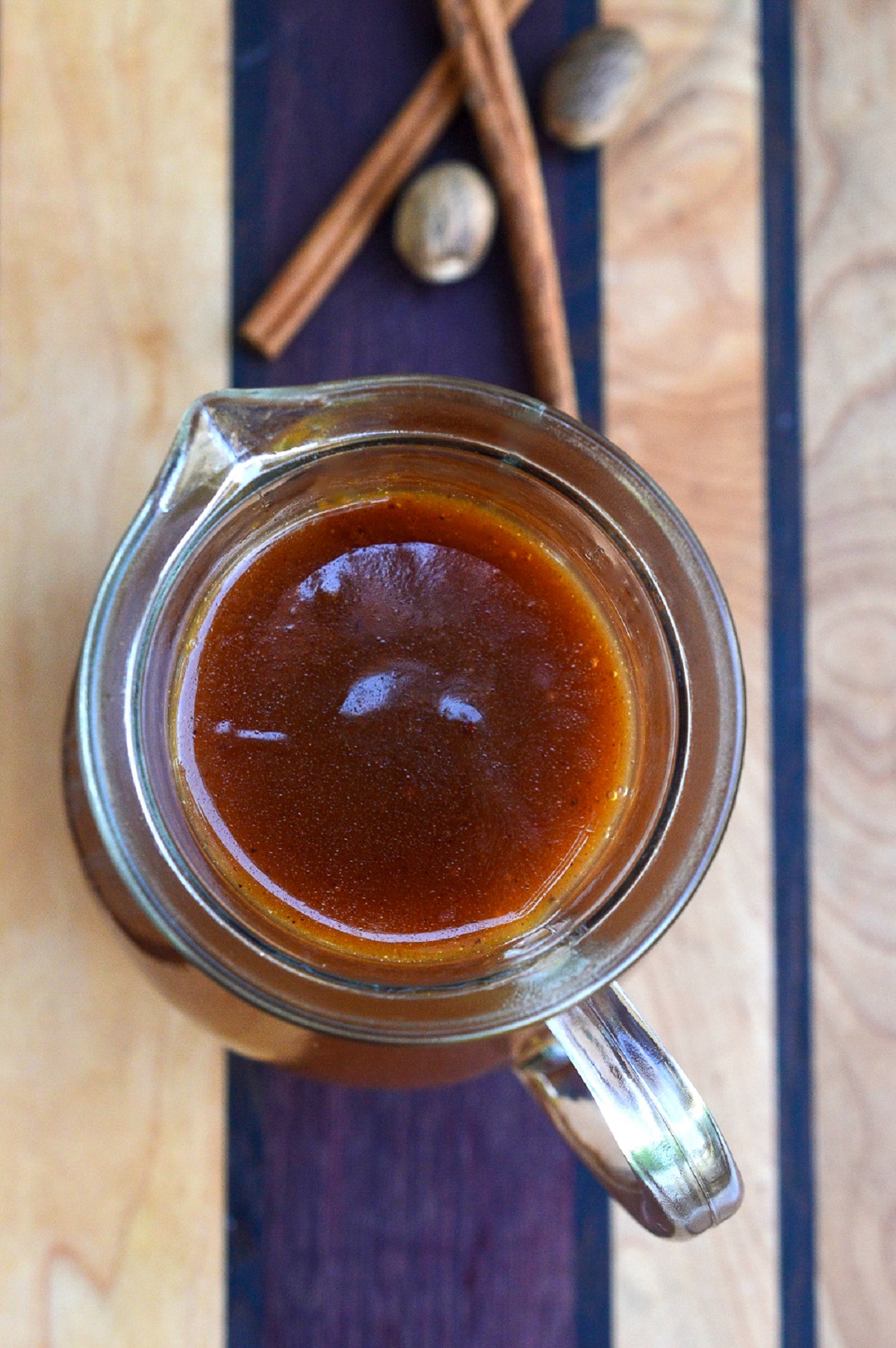 Apple Cider Syrup recipe shown in a small glass pitcher