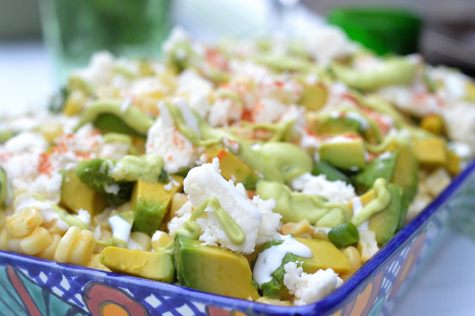 Mexican Street Corn Salad with Avocado in a casserole dish