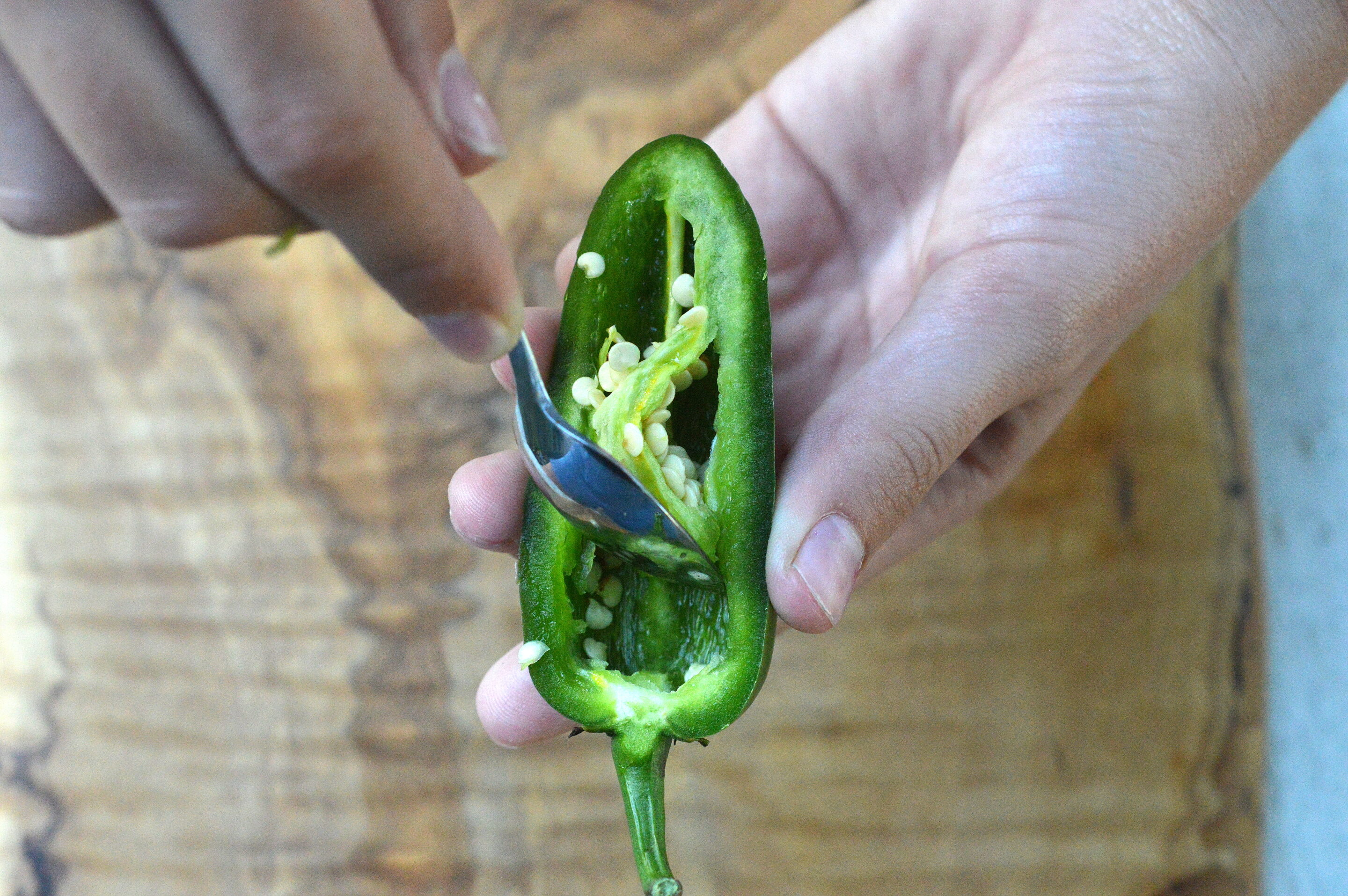 Remove jalapeno seeds and stems easily with a small dessert spoon
