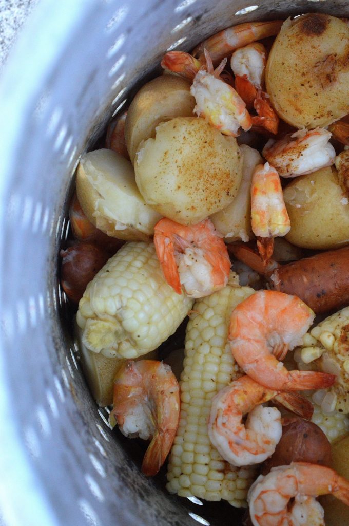 Shrimp Boil with Shrimp Potatoes Corn and Sausage made on the grill in a turkey fryer