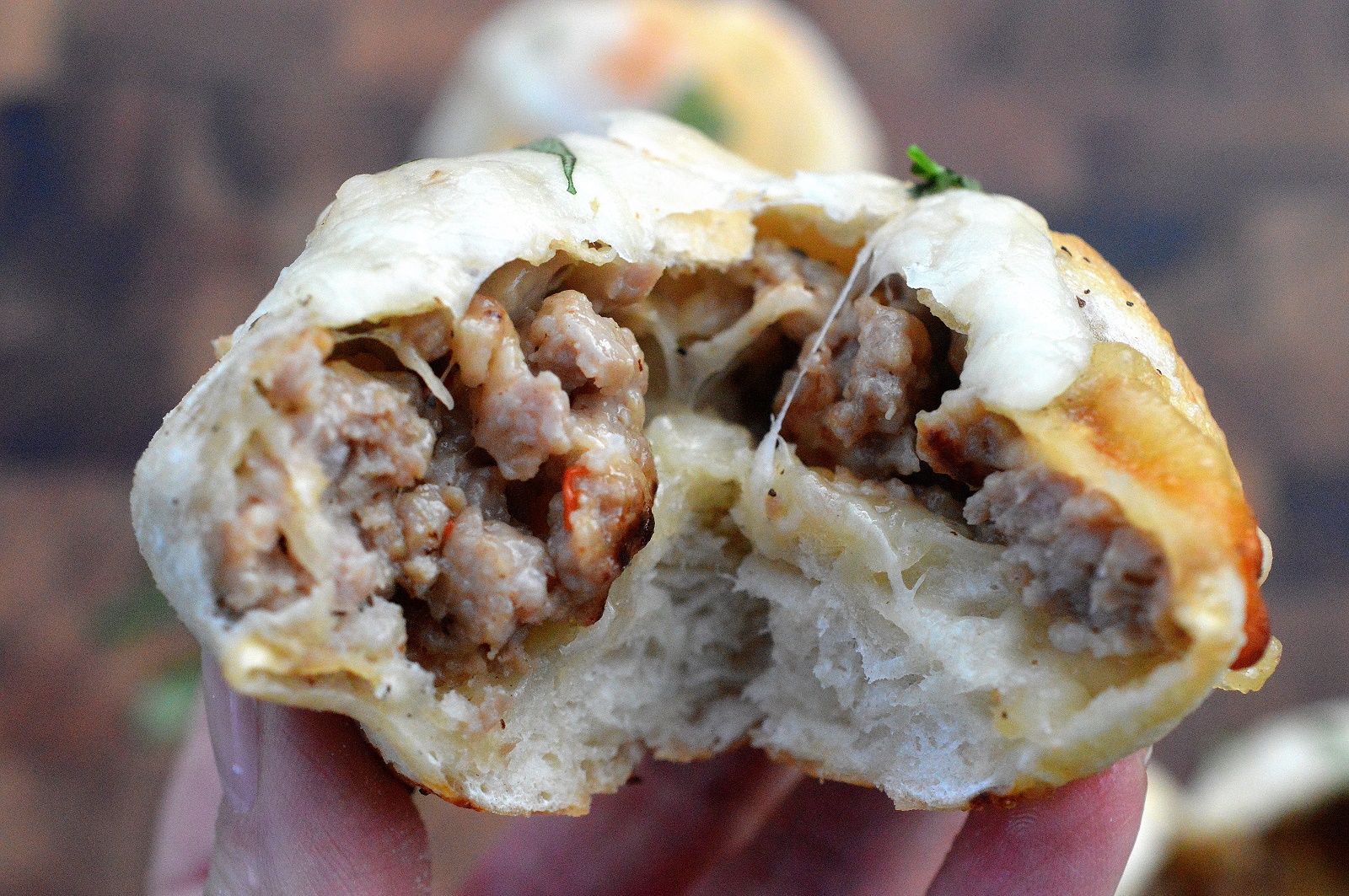 Cheesy Sausage Bombs! warm pizza dough filled with hot or sweet Italian sausage and Mozzarella cheese...Yum! 