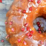 Hot Milk Cake recipe. This vintage sponge cake is simple and delicious, shown in a bundt cake form glazed with caramel. and speckled with pomegranate arils