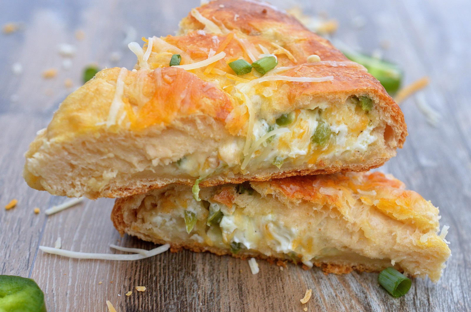 Jalapeno Popper Stuffed Crescent Roll appetizer recipe ring cut into slices. Crescent Roll Ring Recipe.