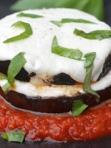 Grilled Eggplant Parmesan. A lightened up version of the original perfect for grilling season! Low carb & gluten free recipe.