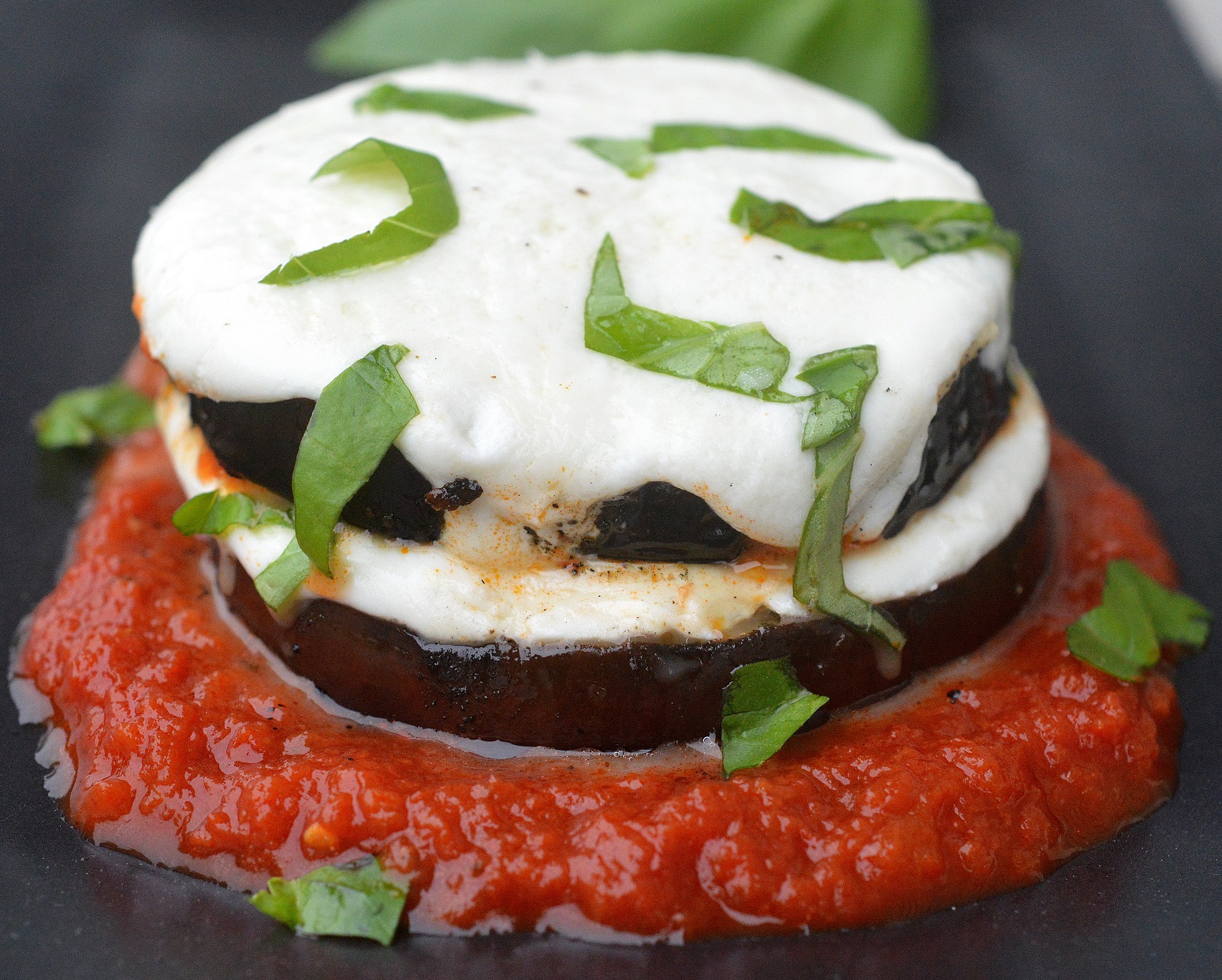 Grilled Eggplant Parmesan. A lightened up version of the original perfect for grilling season! Low carb & gluten free recipe.