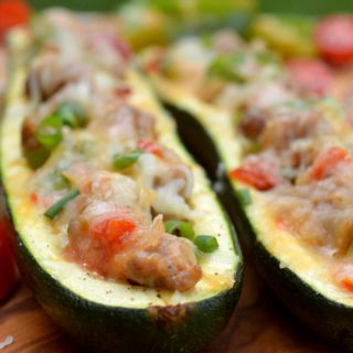 Breakfast Sausage, Pepper, Onion, Tomato and Cheese Stuffed Zucchini THIS is unbelievably delicious for breakfast, lunch or dinner!