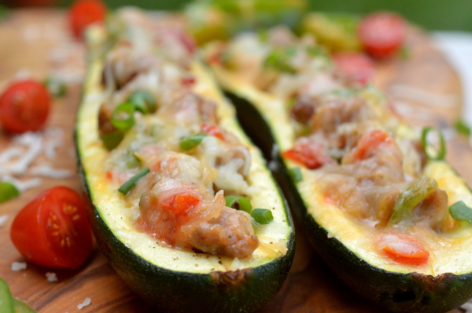 Breakfast Sausage, Pepper, Onion, Tomato and Cheese Stuffed Zucchini THIS is unbelievably delicious for breakfast, lunch or dinner!