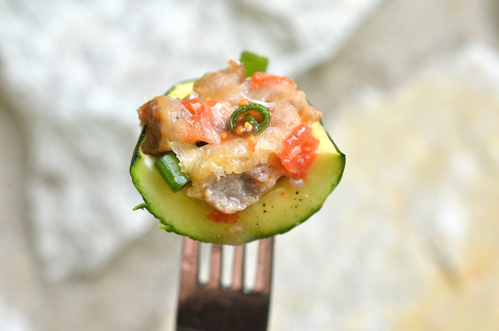 Prepping zucchini for Sausage, Pepper, Onion, Tomato and Cheese Stuffed Zucchini