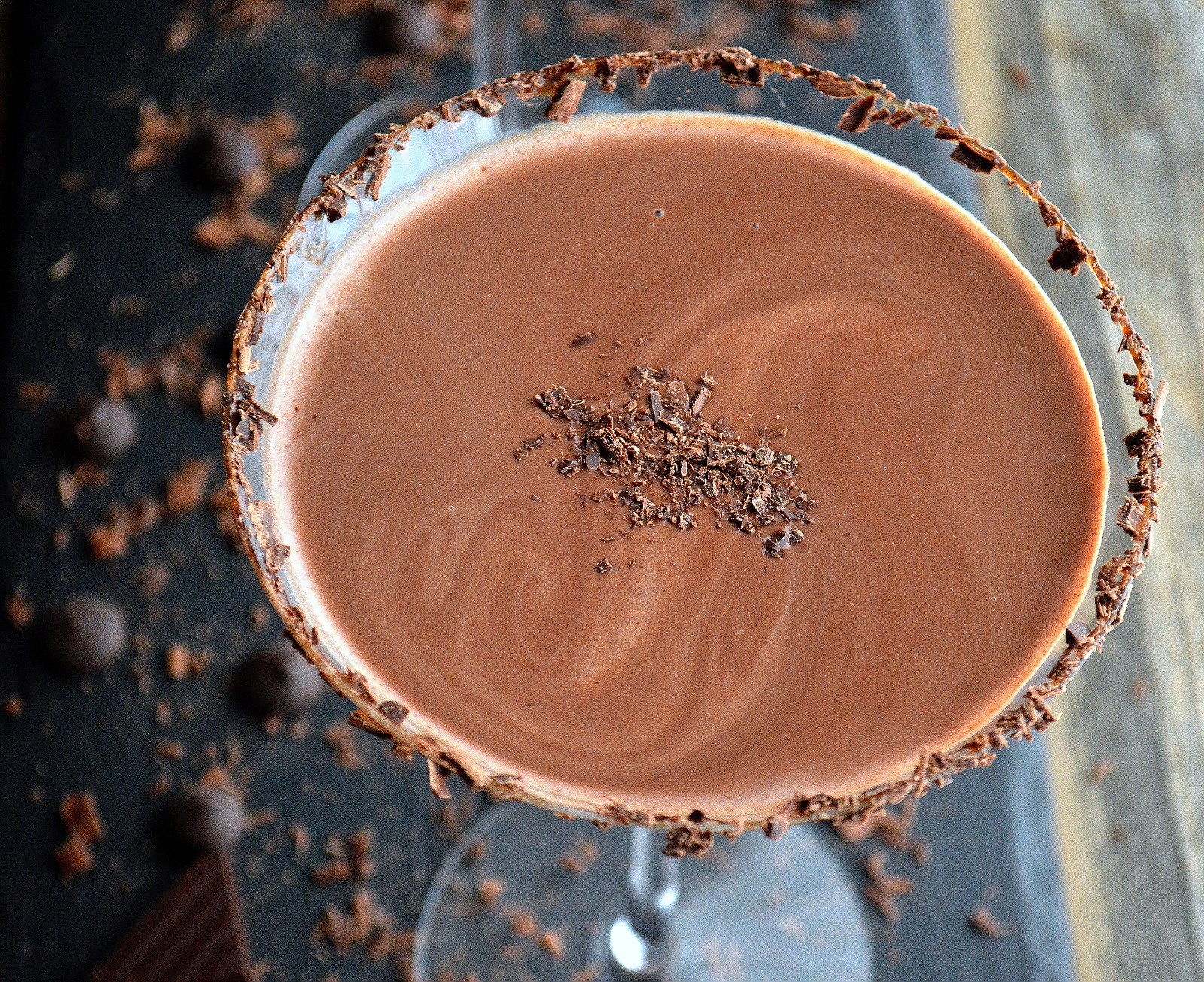 Chocolate Martini in a martini glass that is rimmed in chocolate shavings. 