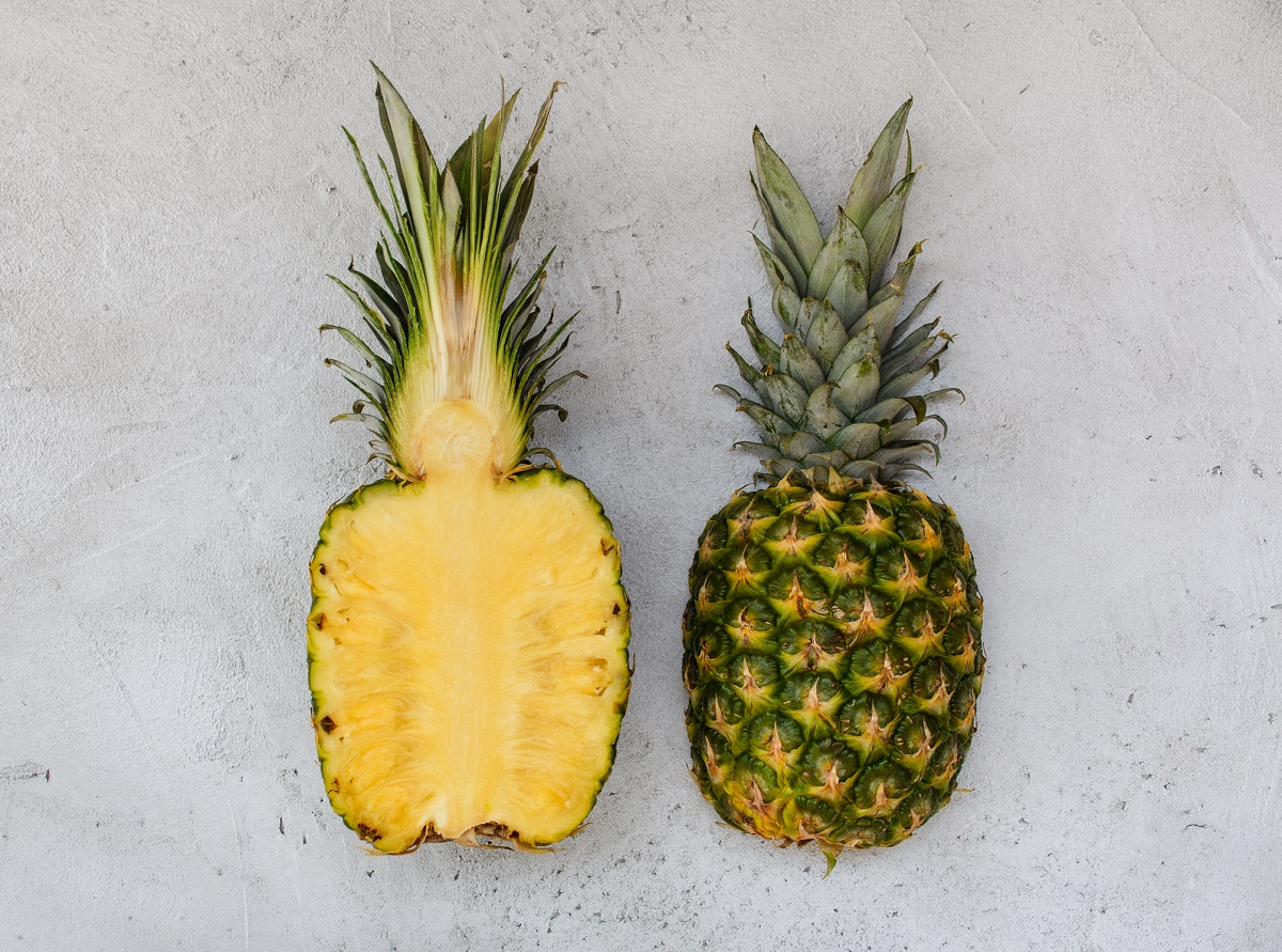 Fresh Pineapple cut completely in half.