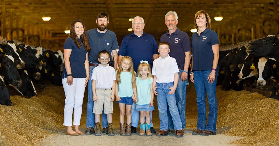 Multi-Generational Dairy Farm Family with dairy cows