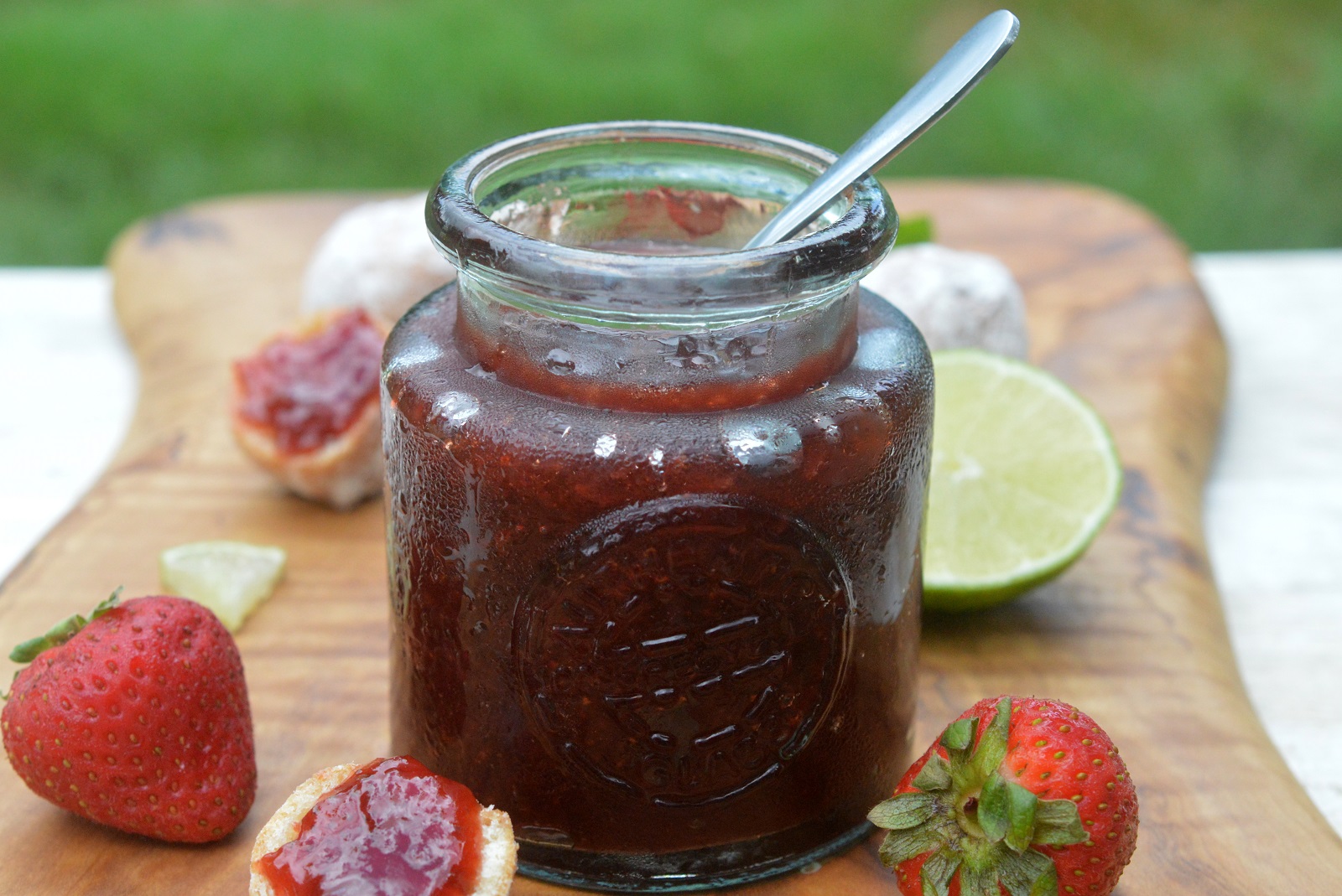 Easy Strawberry Jam recipe pictured in small jar with a spoon