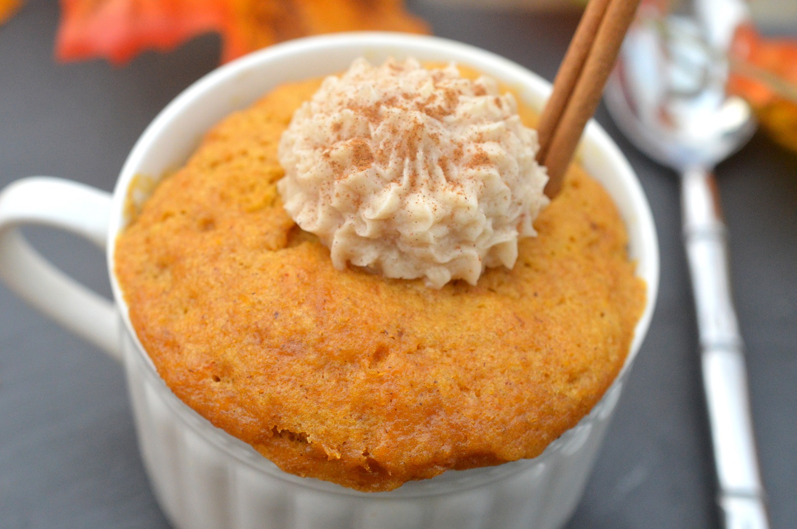 Mug Cake recipe. Pumpkin Mug Cake with Cinnamon frosting in a tea cup.