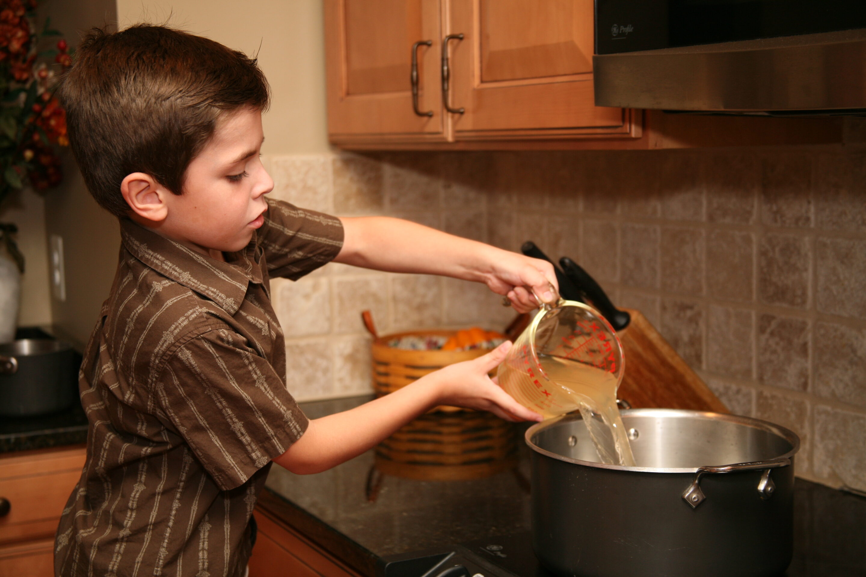 Young boy cooking