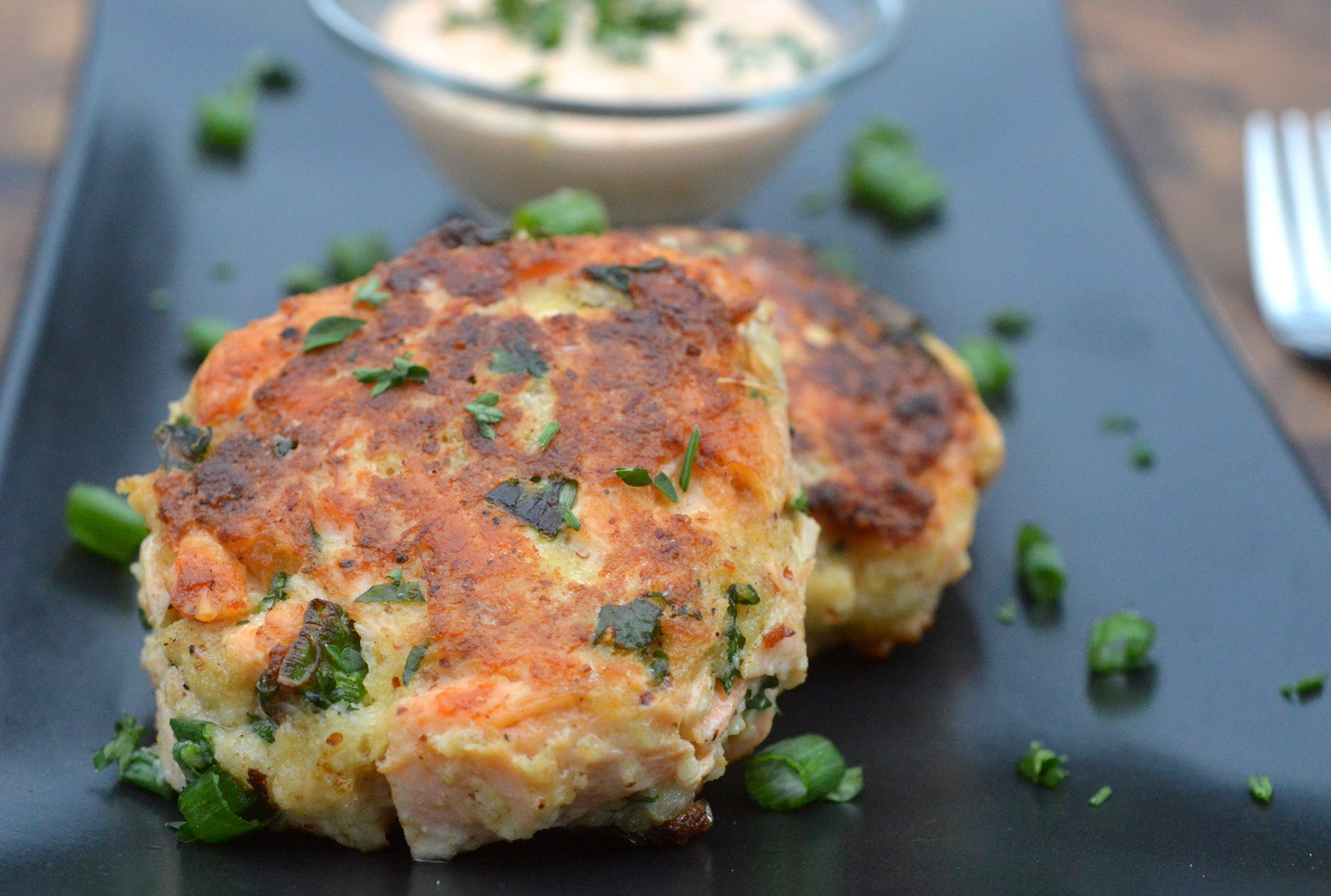 Image of cooked salmon cakes on a plate.