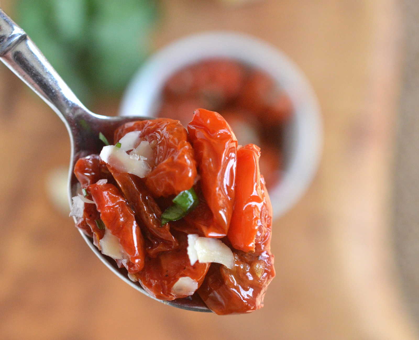 Homemade Sun Dried Tomatoes with Parmesan shown on spoon