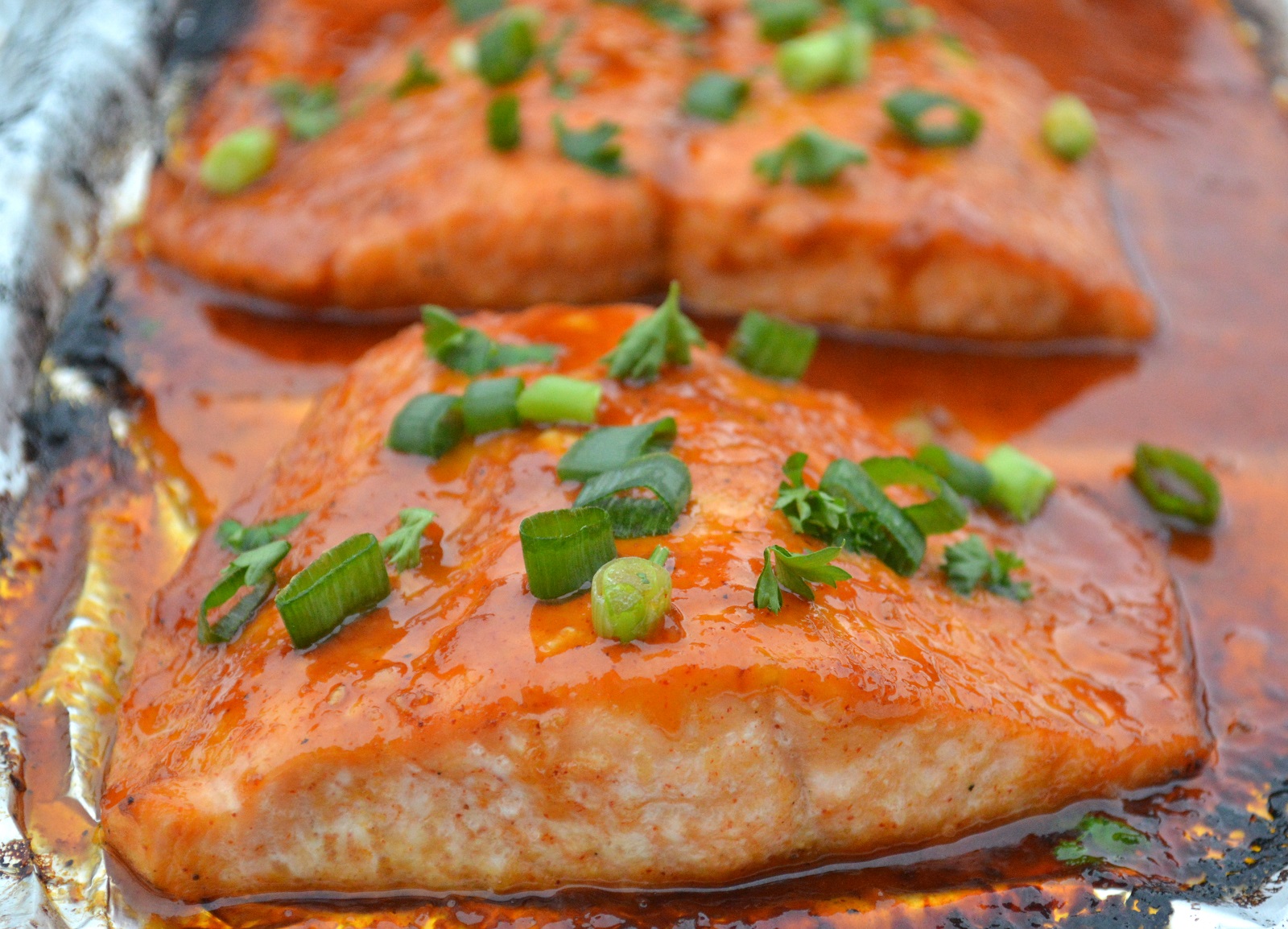 Korean Salmon In Foil Pieces of cooked and glazed salon in foil