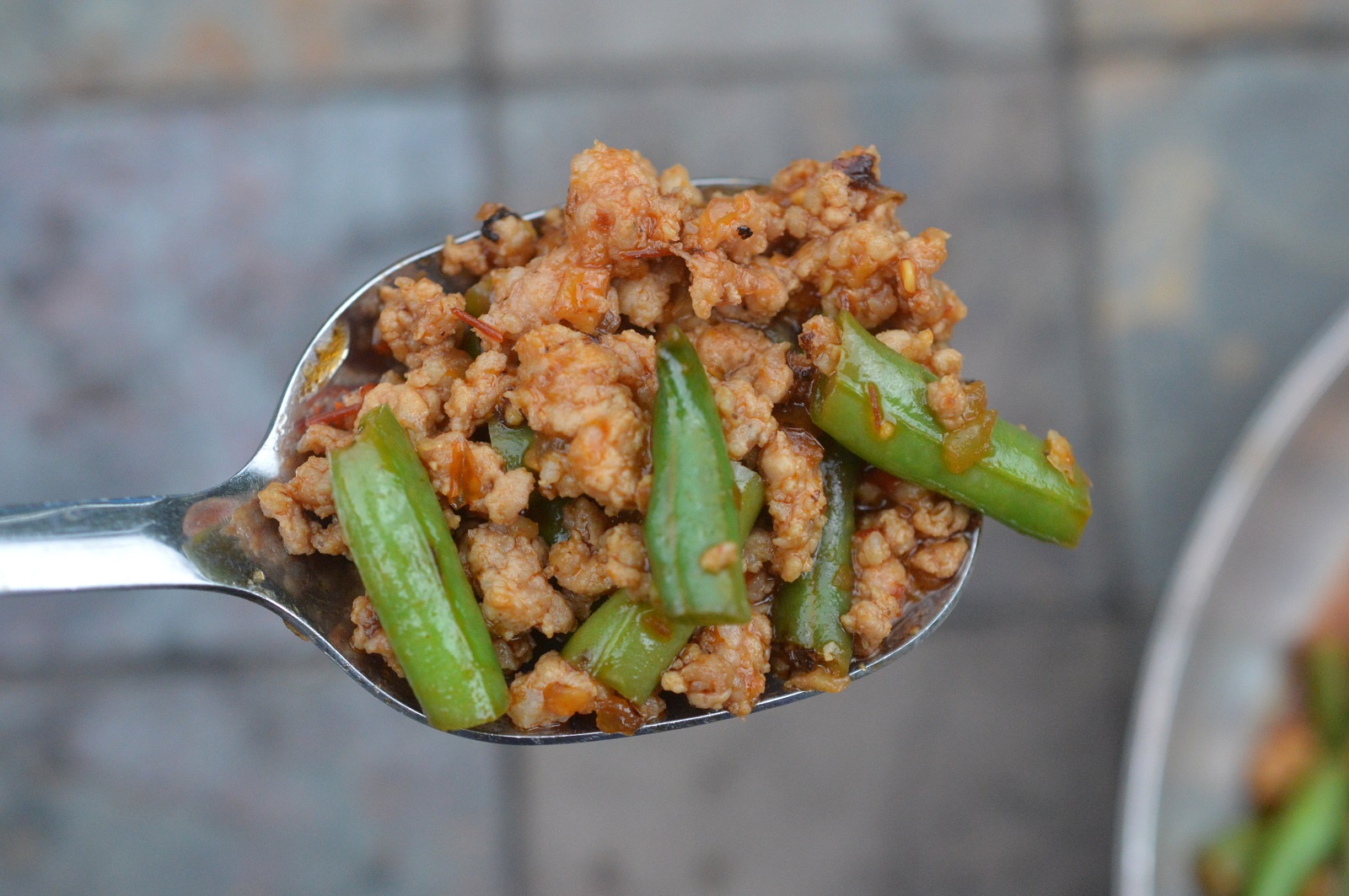 Easy delicious Ground Meat & String Bean Asian Stir Fry shown on spoon.