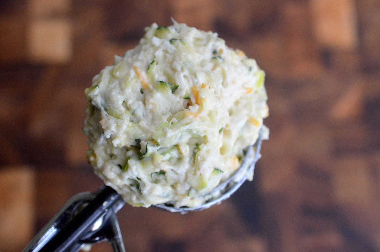 Use a cookie scoop to measure out the biscuit batter.