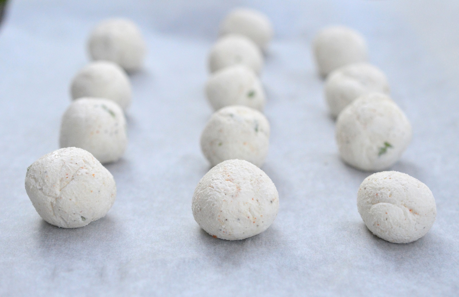 rolling and shaping mini cheese balls