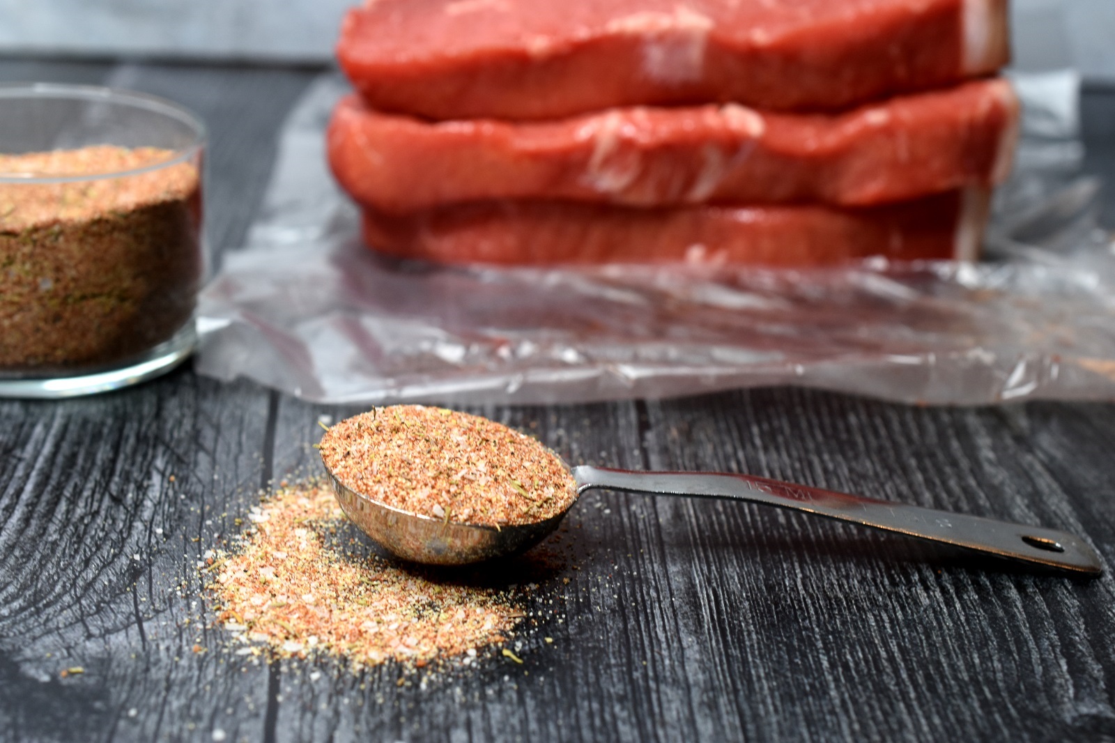 5 Minute Homemade Steak Seasoning recipes pictured with raw ribeye steaks