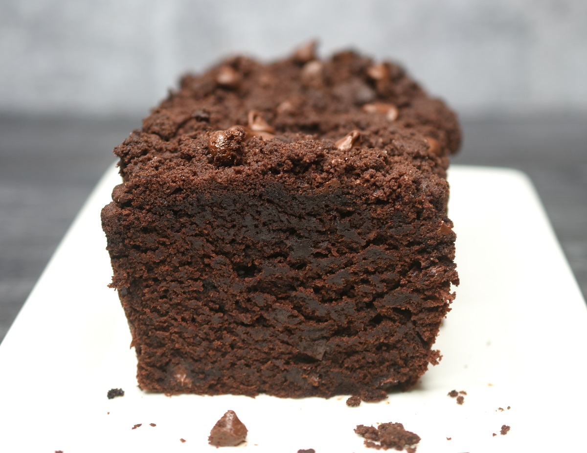 loaf of chocolate banana bread with chocolate streusel once slice cut from loaf