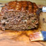 Meatloaf cooked on the grill, ready to be enjoyed, sliced open.