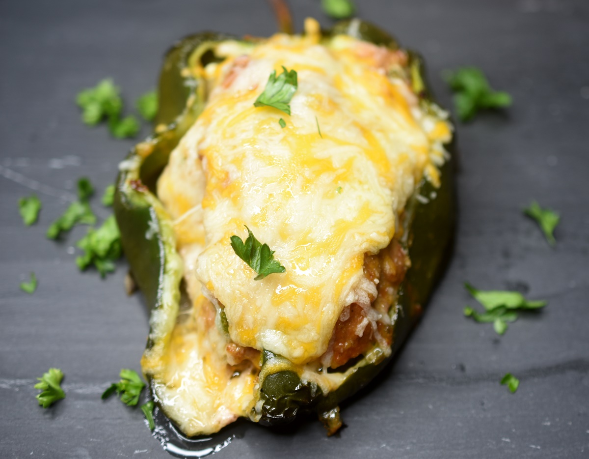 Grilled Meatloaf Stuffed Peppers topped with melted cheese 