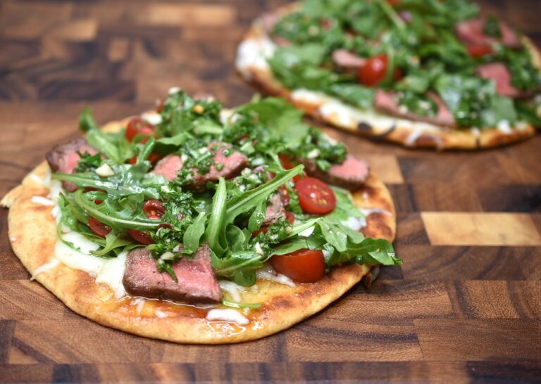 2 Chimichurri Steak Flatbreads on a wooden cutting board