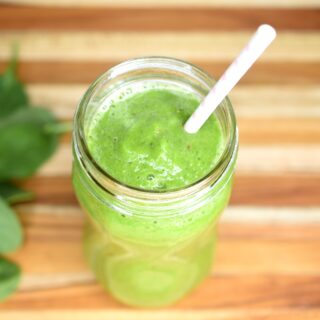 Favorite 4 Ingredient Green Smoothie in glass with straw