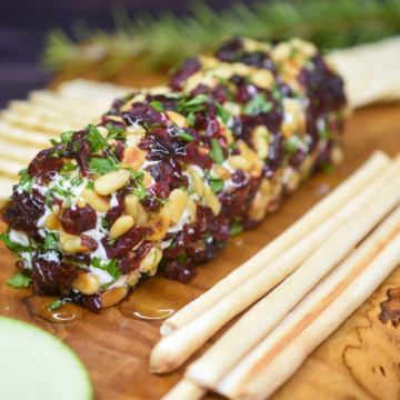 Holiday Goat Cheese Appetizer. Simple but spectacular! Cranberry & nut encrusted goat cheese log