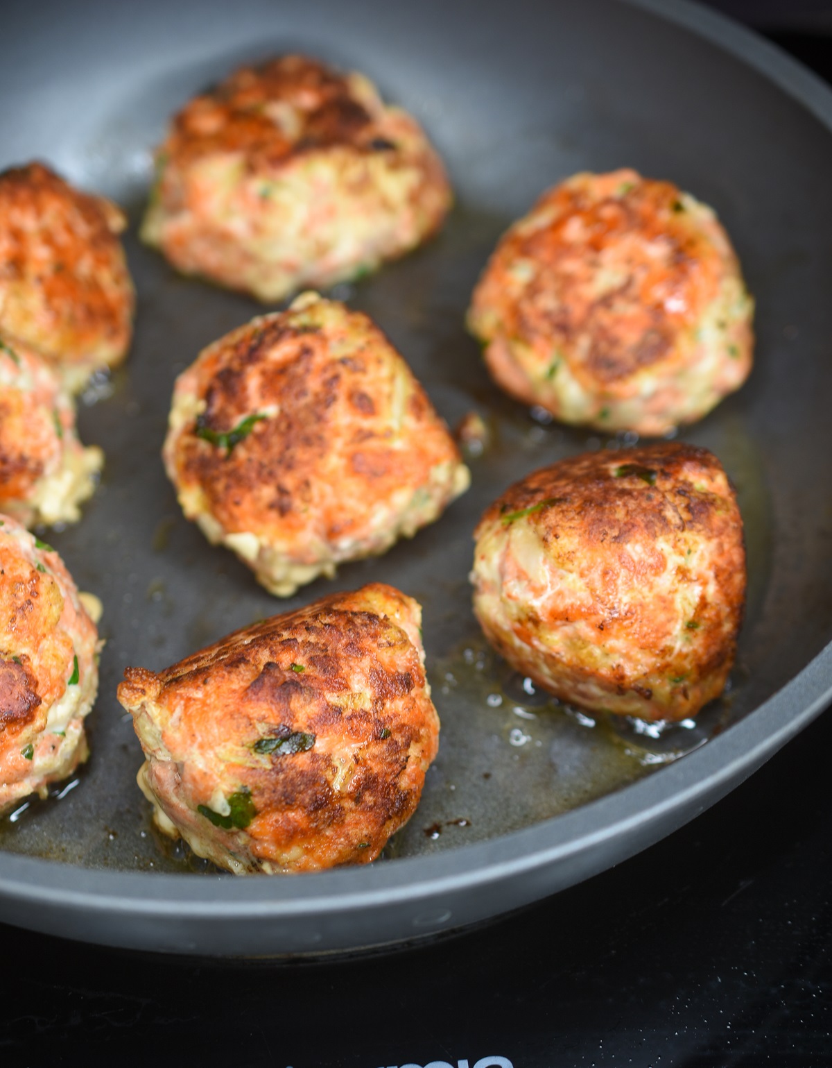 Salmon Balls cooking in a pan