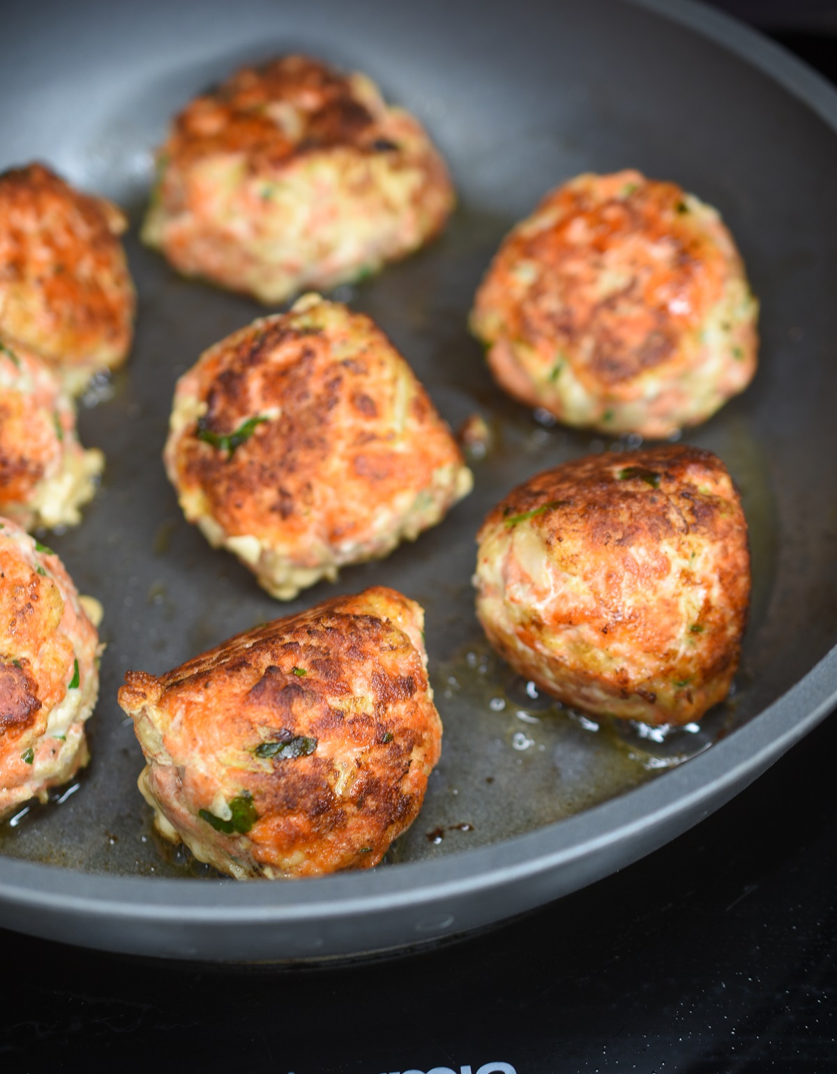 Salmon Balls cooking in a pan.
Salmon Balls recipe. 