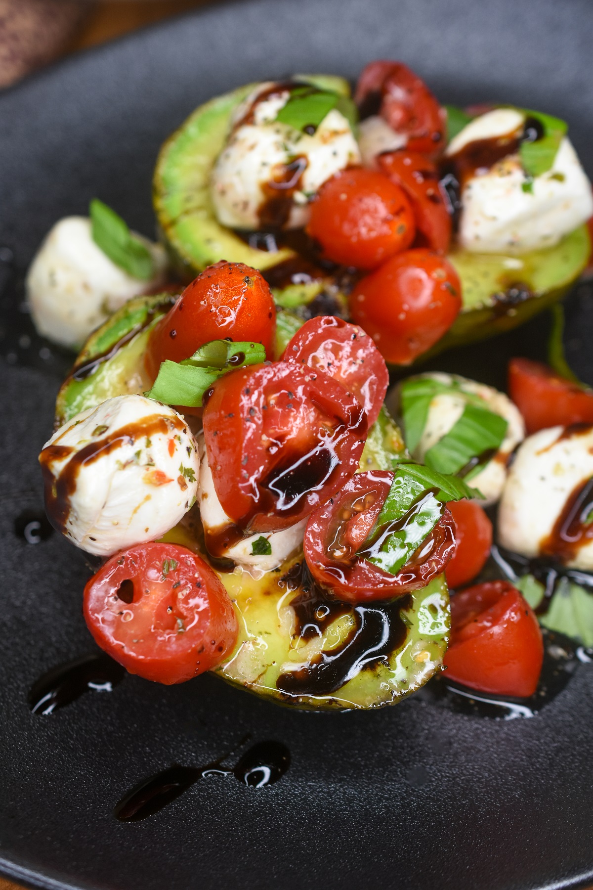 Grilled Avocado stuffed with caprese salad