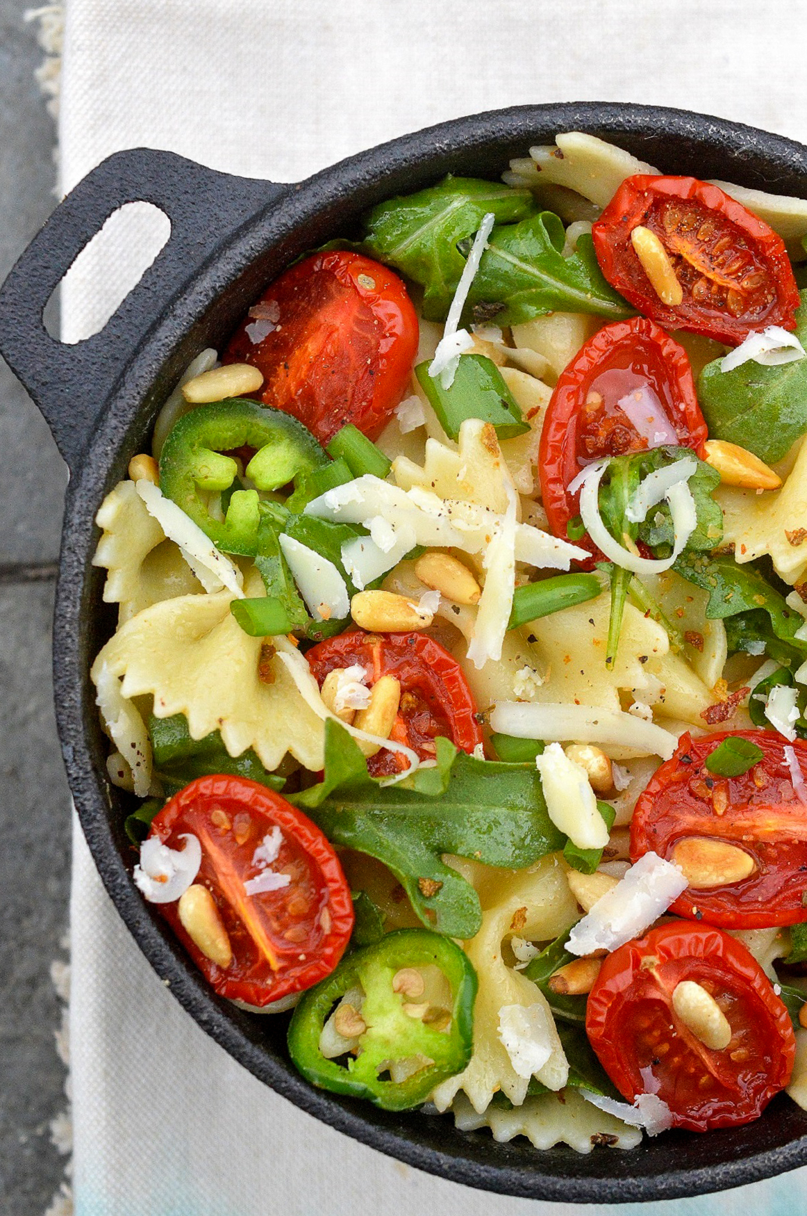 Summer Pasta Salad with Roasted Tomatoes , Parmesan Cheese and Pine Nuts. Bow Tie Pasta Salad.