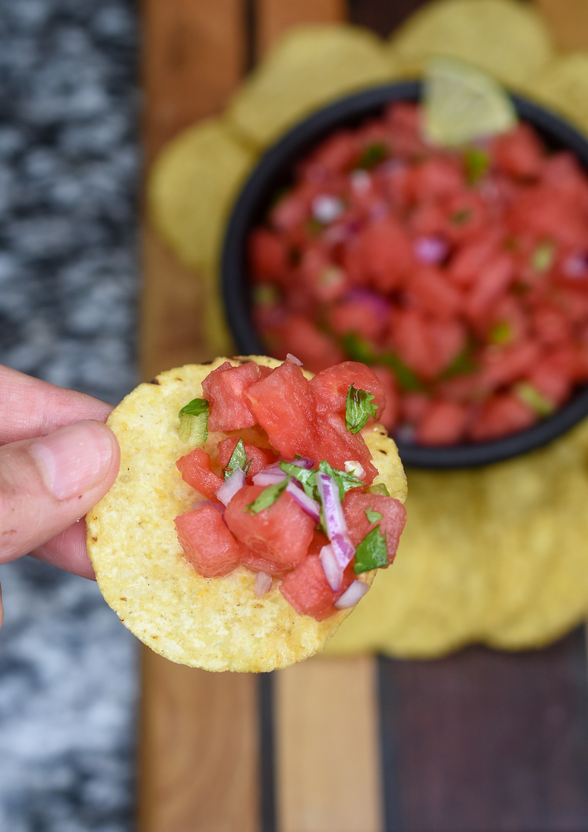 Watermelon Salsa recipe, super refreshing and a great BBQ recipe. Shown on a tortilla chip