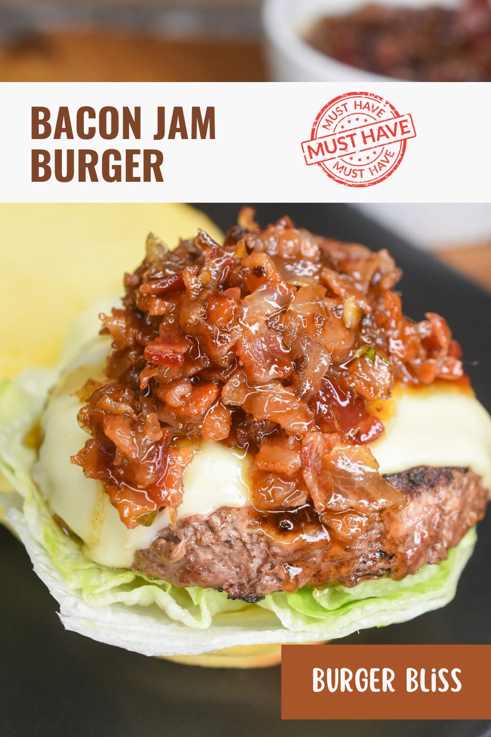 Bacon Jam Burgers. Burger with cheese on a bun topped with bacon jam.