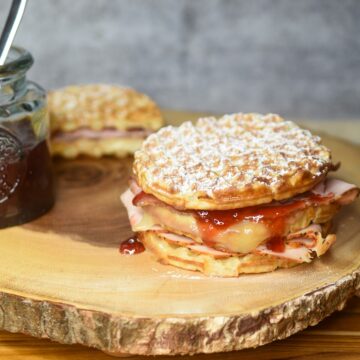 Monte Cristo Waffle Sandwich with homemade strawberry jam dusted with powdered sugar