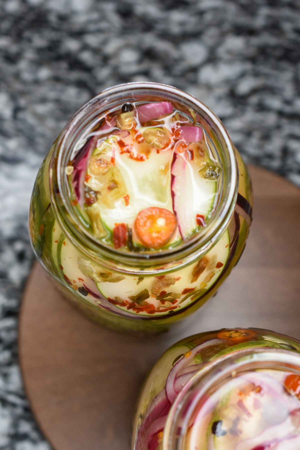 Mason jar full of homemade spicy pickled cucumbers 