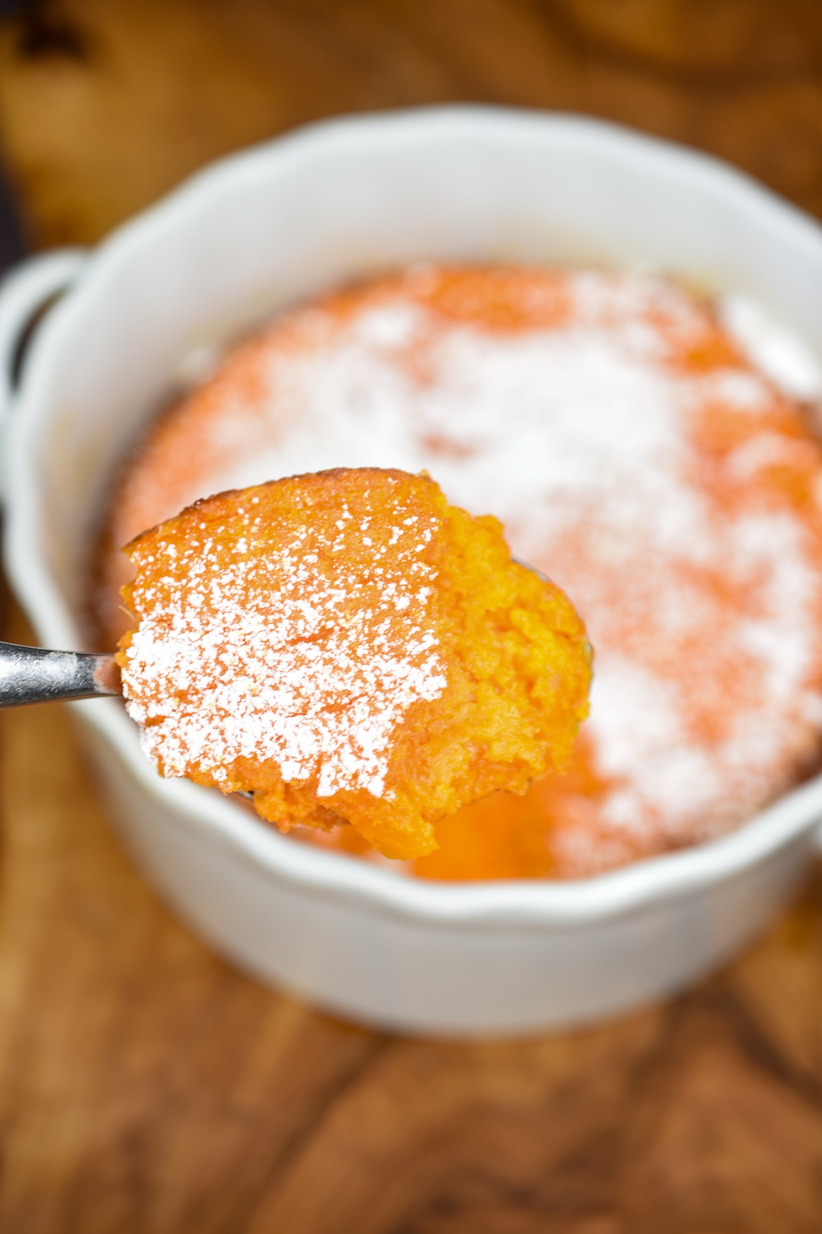 From the famed Picadilly Cafeteria, Carrot Souffle is a lovely side dish recipe for the holidays or a Sunday dinner. Carrot Souffle recipe shown in a white baking dish topped with powdered sugar.